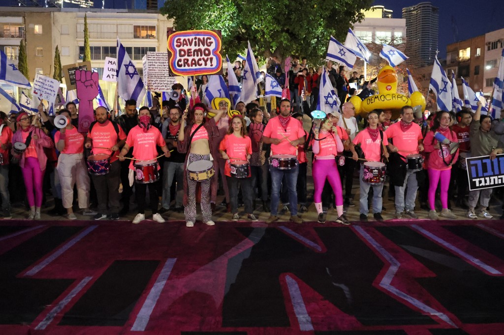 Scores of protestors are taking to the streets to protest Netanyahu's latest government's attempts at a judicial coup (File/AFP)