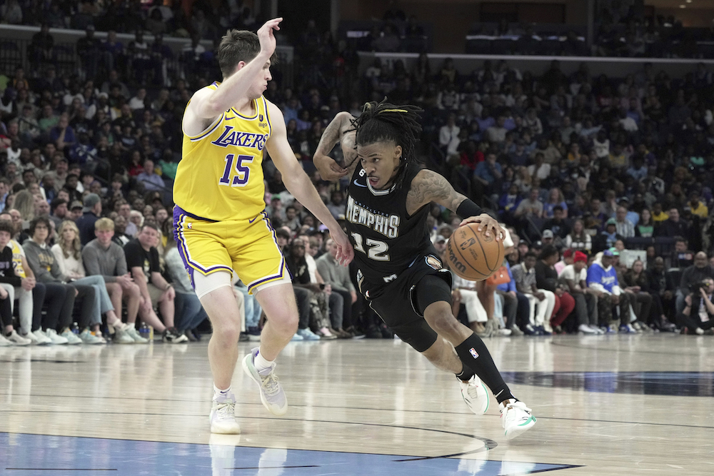 Memphis Grizzlies Ja Morant drives to the basket against Los Angeles Lakers Austin Reaves in the second half of an NBA basketball game Tuesday in Memphis, Tenn. (AP)