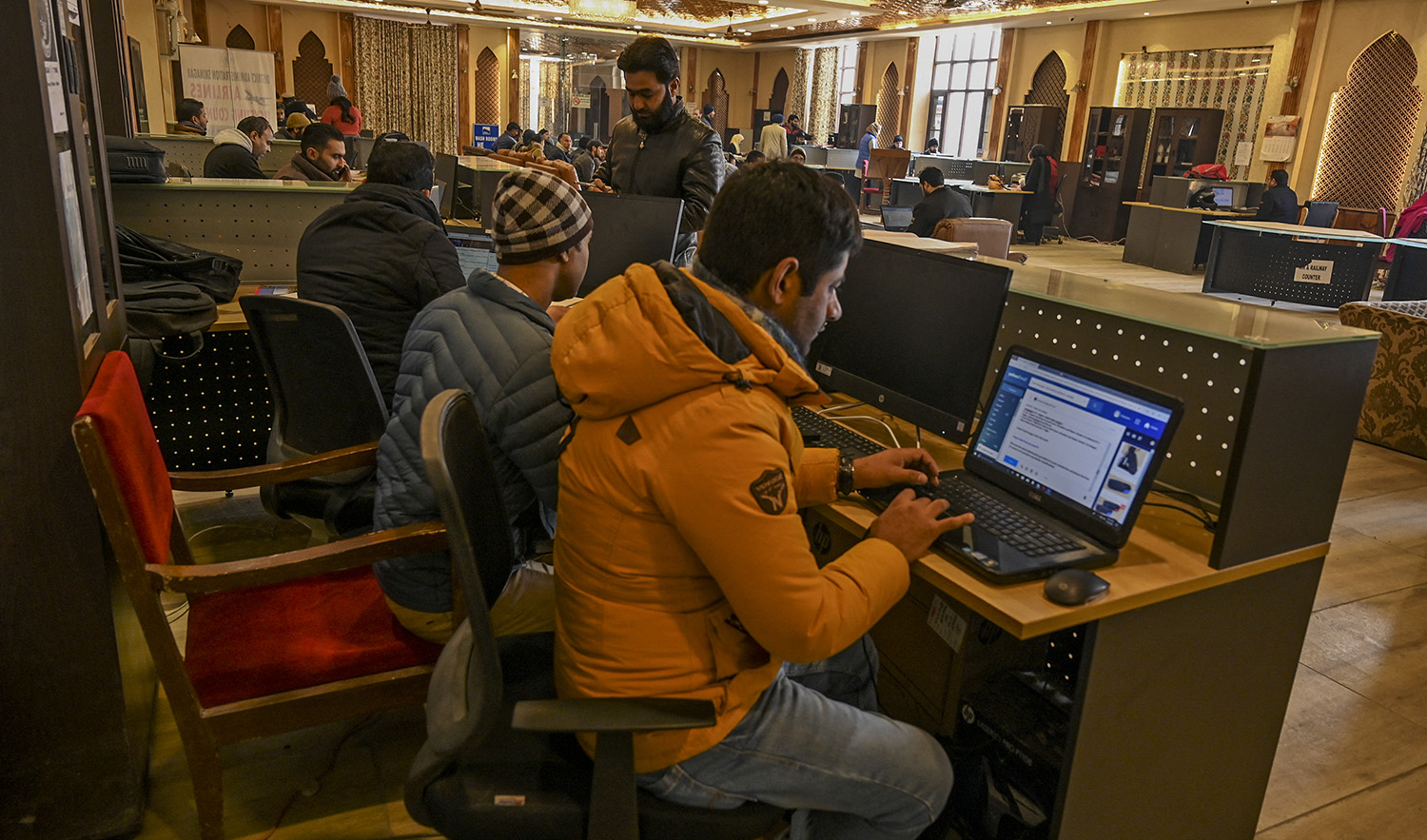 In this photo taken on December 3, 2019, Kashmiri students use the internet at a Tourist Reception Centre (TRC) in Srinagar internet shutdown across the region as part of a partial communication blockade by the Indian government. (AFP/File)