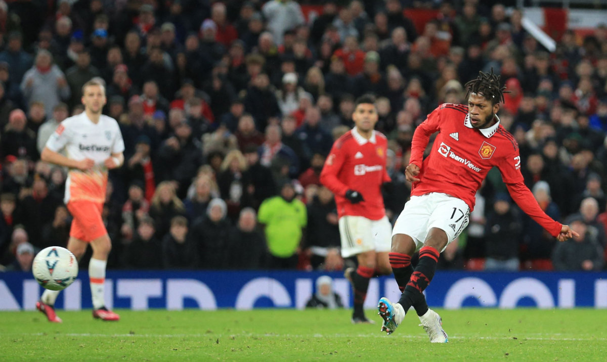 Manchester United's Brazilian midfielder Fred scores his team third goal during their English FA Cup fifth round football match against West Ham at Old Trafford in Manchester, north west England, on Wednesday. (AFP)
