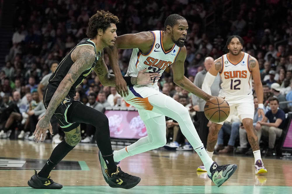 Phoenix Suns forward Kevin Durant drives to the basket past Charlotte Hornets guard Kelly Oubre Jr. during the second half of an NBA basketball game on Wednesday in Charlotte, N.C. (AP)