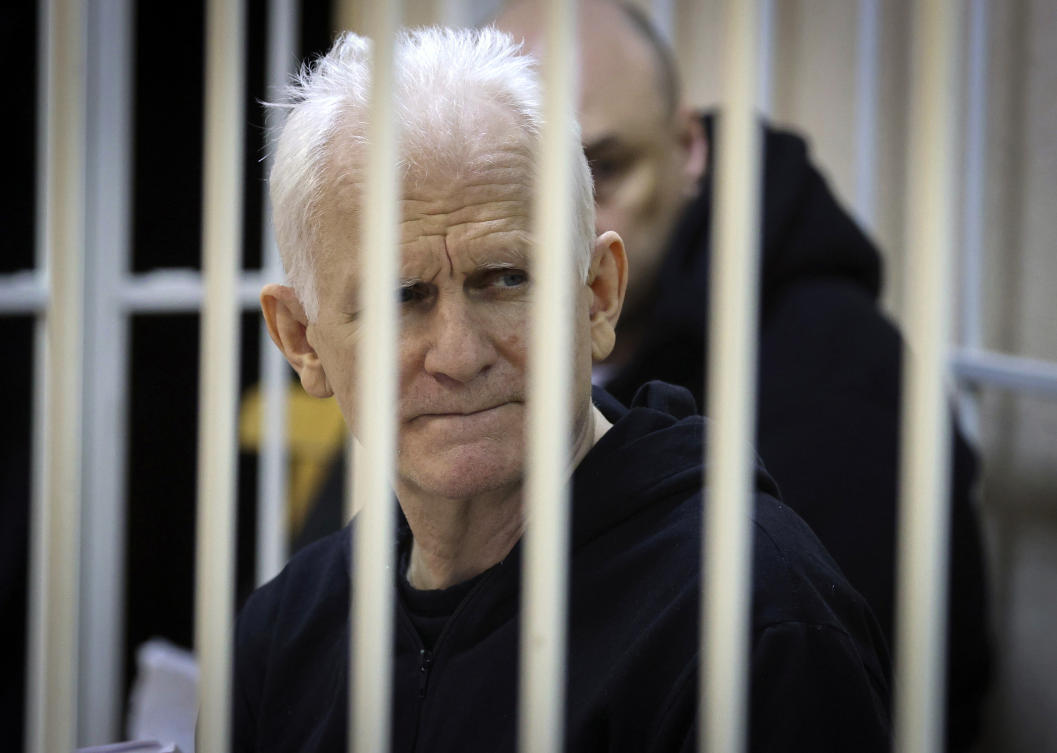 Ales Bialiatski, the head of Belarusian Vyasna rights group, sits in a defendants’ cage during a court session in Minsk, Belarus, on Jan. 5, 2023. (AP/File)