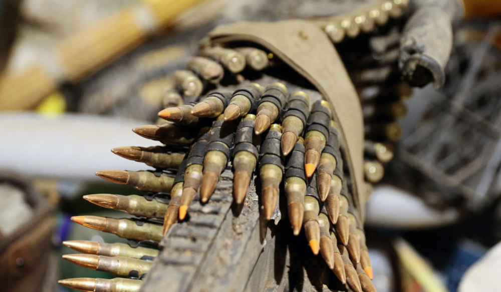 This photograph taken on March 3, 2023, shows a view of a machine gun and ammunition cartridges in Bakhmut, in the Donetsk region on March 3, 2023. (AFP)