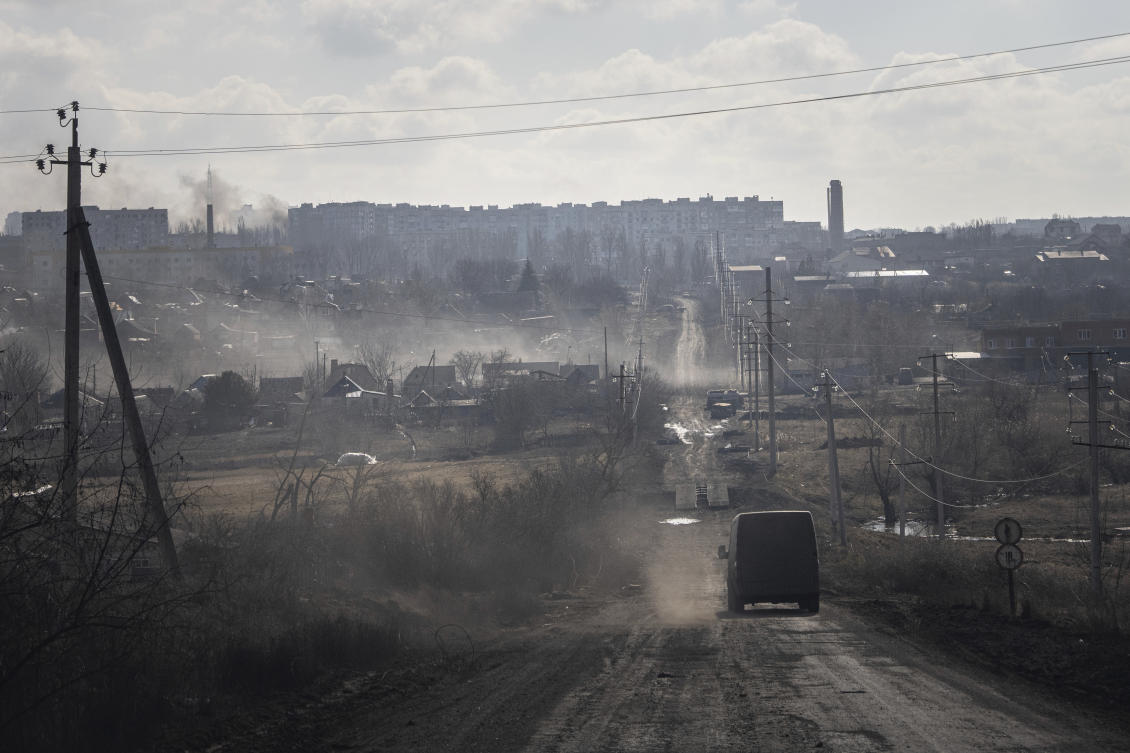 A Ukrainian police van drives on the highway for evacuation civilians in Khromove near Bakhmut, Ukraine ON Mar. 4, 2023. (AP)