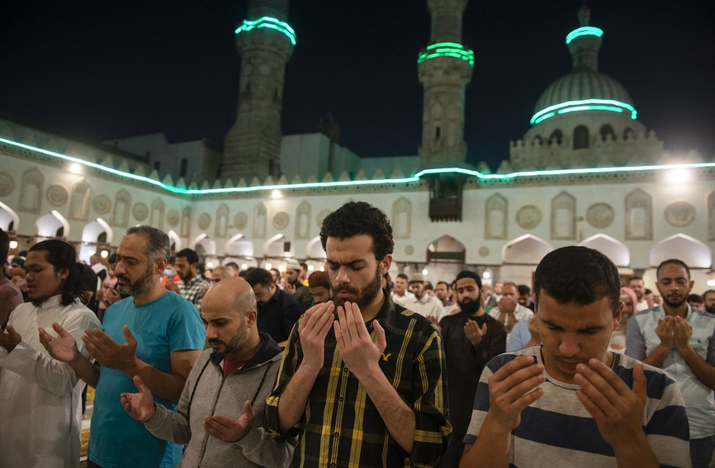 Muslim worshippers pray on Laylat al-Qadr (Night of Destiny) during the holy month of Ramadan, at the Al-Azhar Mosque in the Egyptian capital Cairo, on April 27, 2022. (AFP)