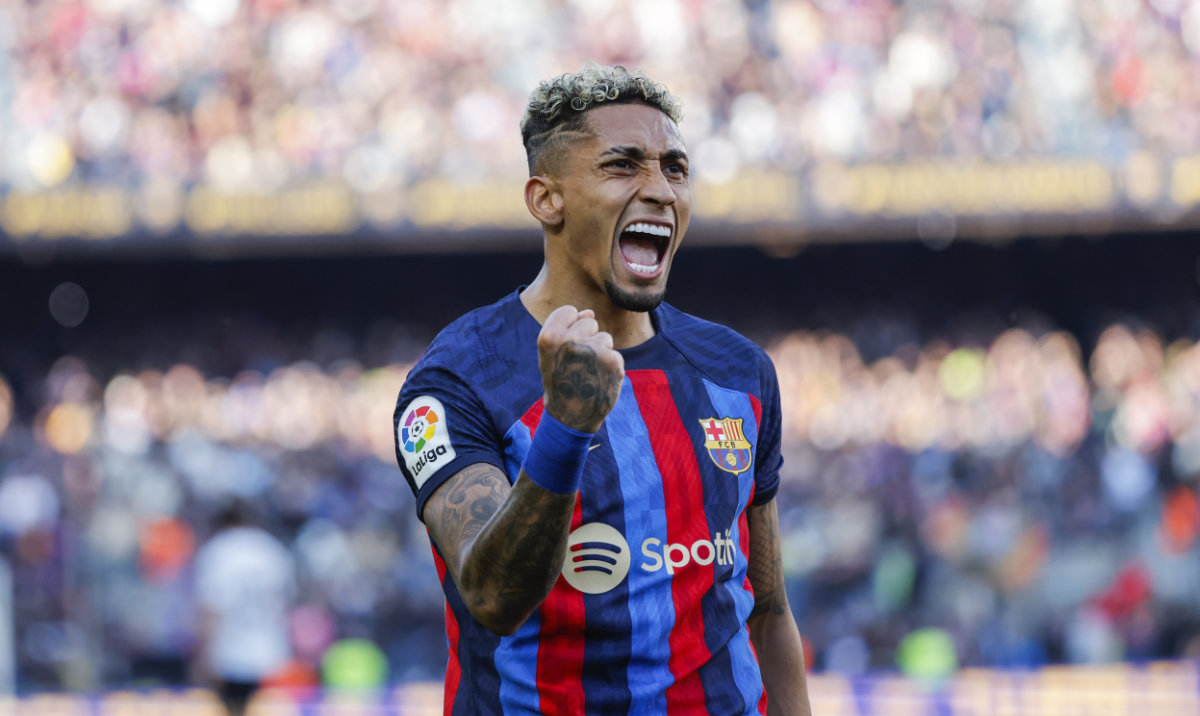 Barcelona's Raphinha celebrates scoring his side's opening goal during Spanish La Liga soccer match between Barcelona and Valencia at the Camp Nou stadium in Barcelona, Spain, Sunday, March 5, 2023. (AP)