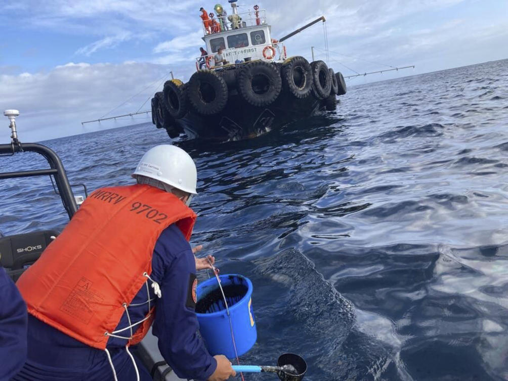 About 36,000 hectares of coral reef, mangroves and sea-grass are potentially in danger of being affected by the oil slick, according to marine scientists. (Philippine Coast Guard via AP)