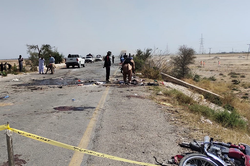 Pakistani security officials examine the site after a suicide attack on a police truck in Kachhi district, Balochistan province on March 6, 2023. (AFP)