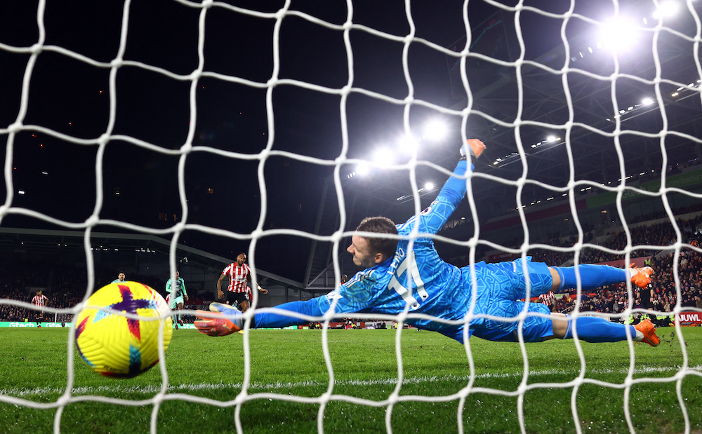 Brentford’s Ivan Toney scores their second goal from the penalty spot past Fulham’s Bernd Leno in a Premier League match on Monday. (Reuters)