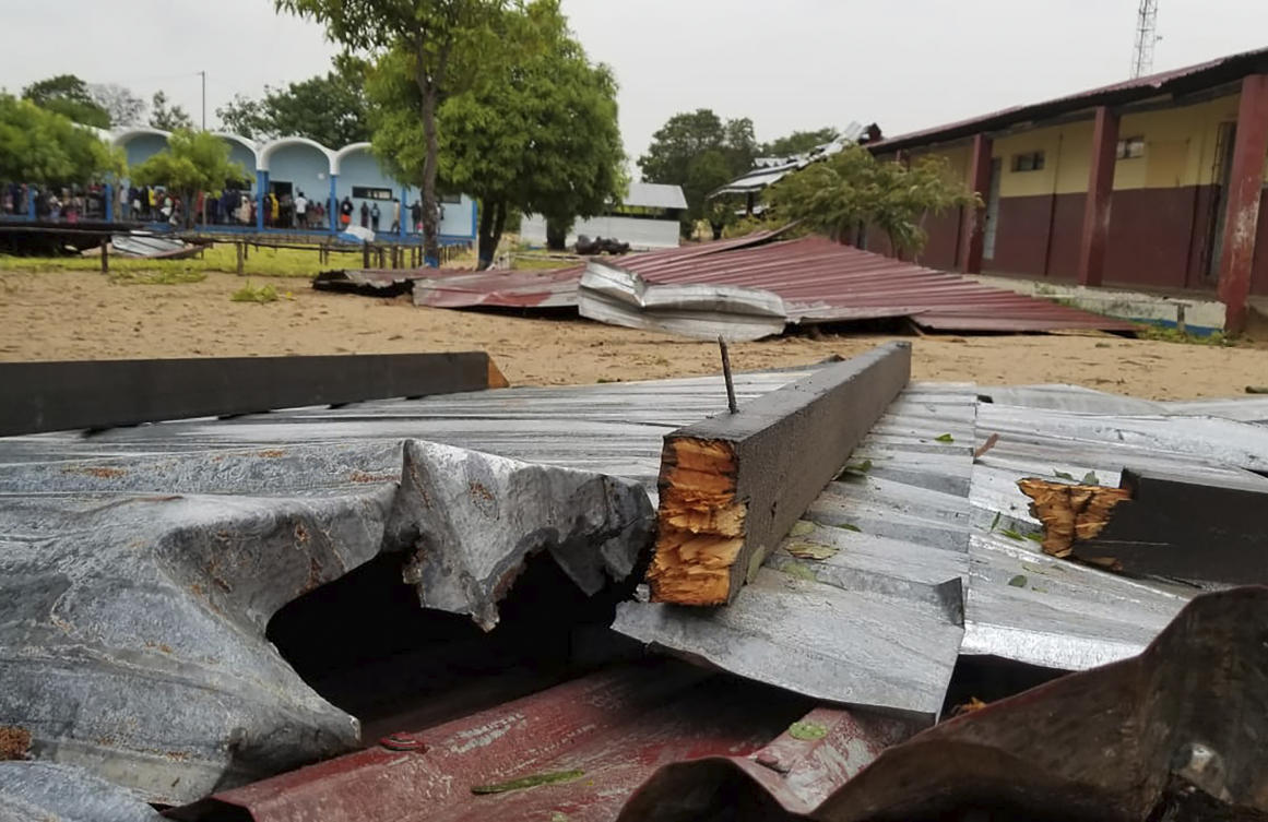 The damaged roof of a school lies in the playground in Vilanculos, Mozambique, on Feb. 24. 2023. (AP)