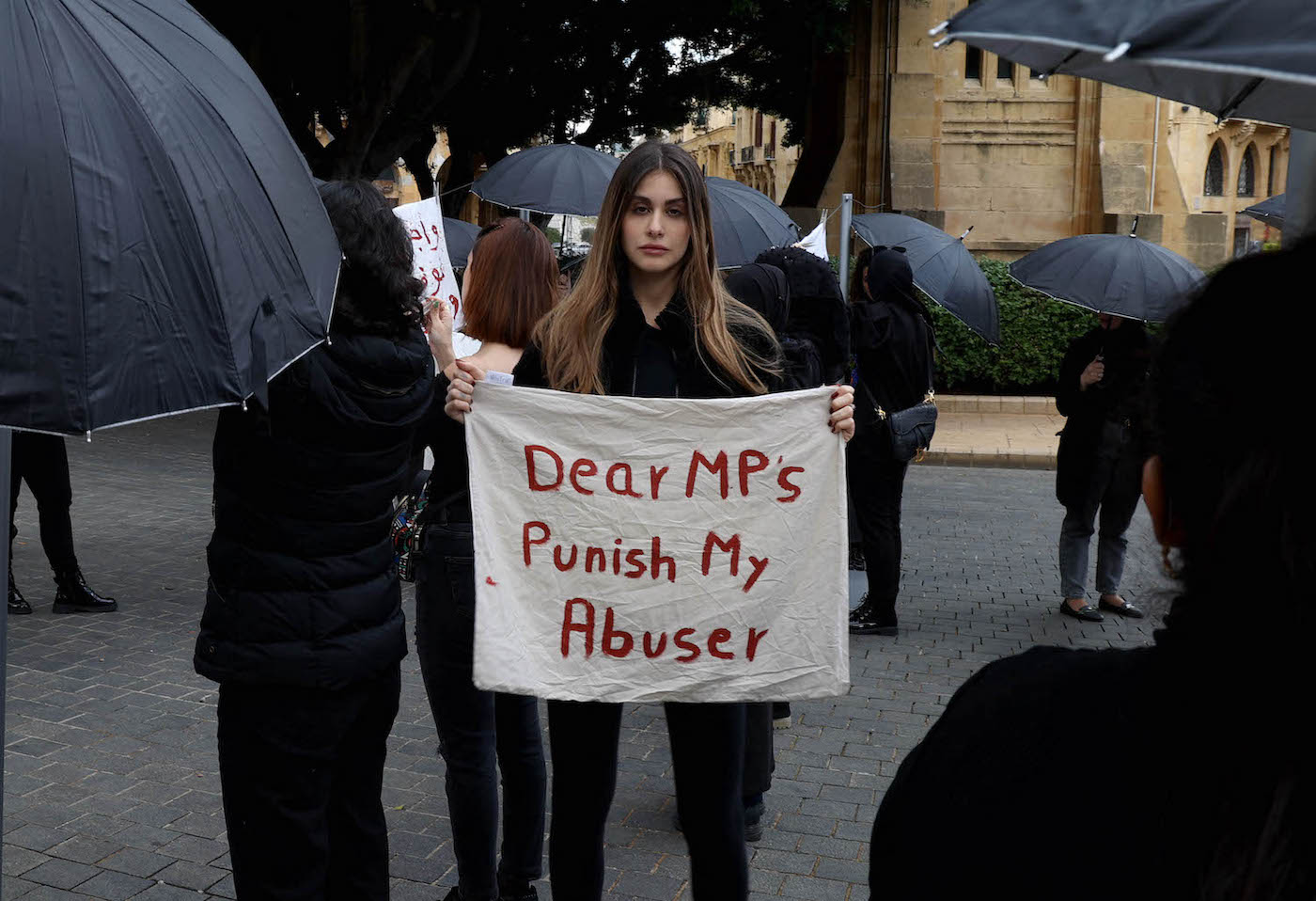 US-Lebanese model Nour Arida (C) join activists and survivors in front of the Lebanese parliament, in Beirut. (File/AFP)