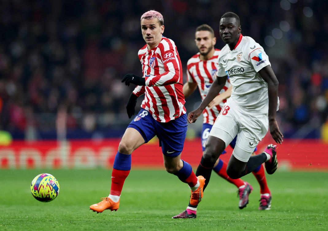 Sevilla’s Pape Gueye in action with Atletico Madrid’s Antoine Griezmann during their La Liga match at Metropolitano, Madrid on Mar. 4, 2023 (Reuters)