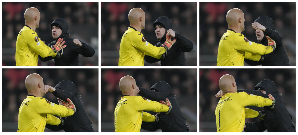 This combo shows a sequence of six images of a PSV supporter punching Sevilla’s goalkeeper Marko Dmitrovic in the face during their Europa League playoff second leg match at the Philips stadium in Eindhoven on Feb. 23, 2023. (AP/File)