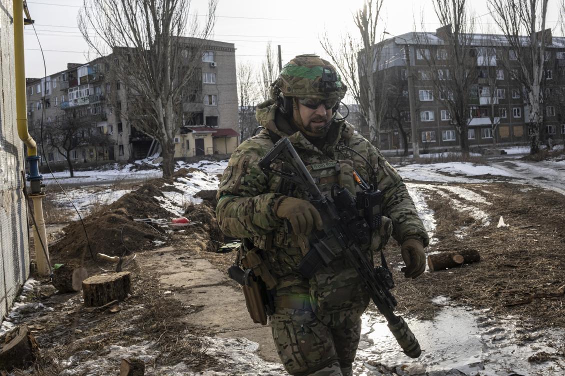 A Ukrainian serviceman patrols a street in Bakhmut, Ukraine on Feb. 24, 2023. (AP/File)
