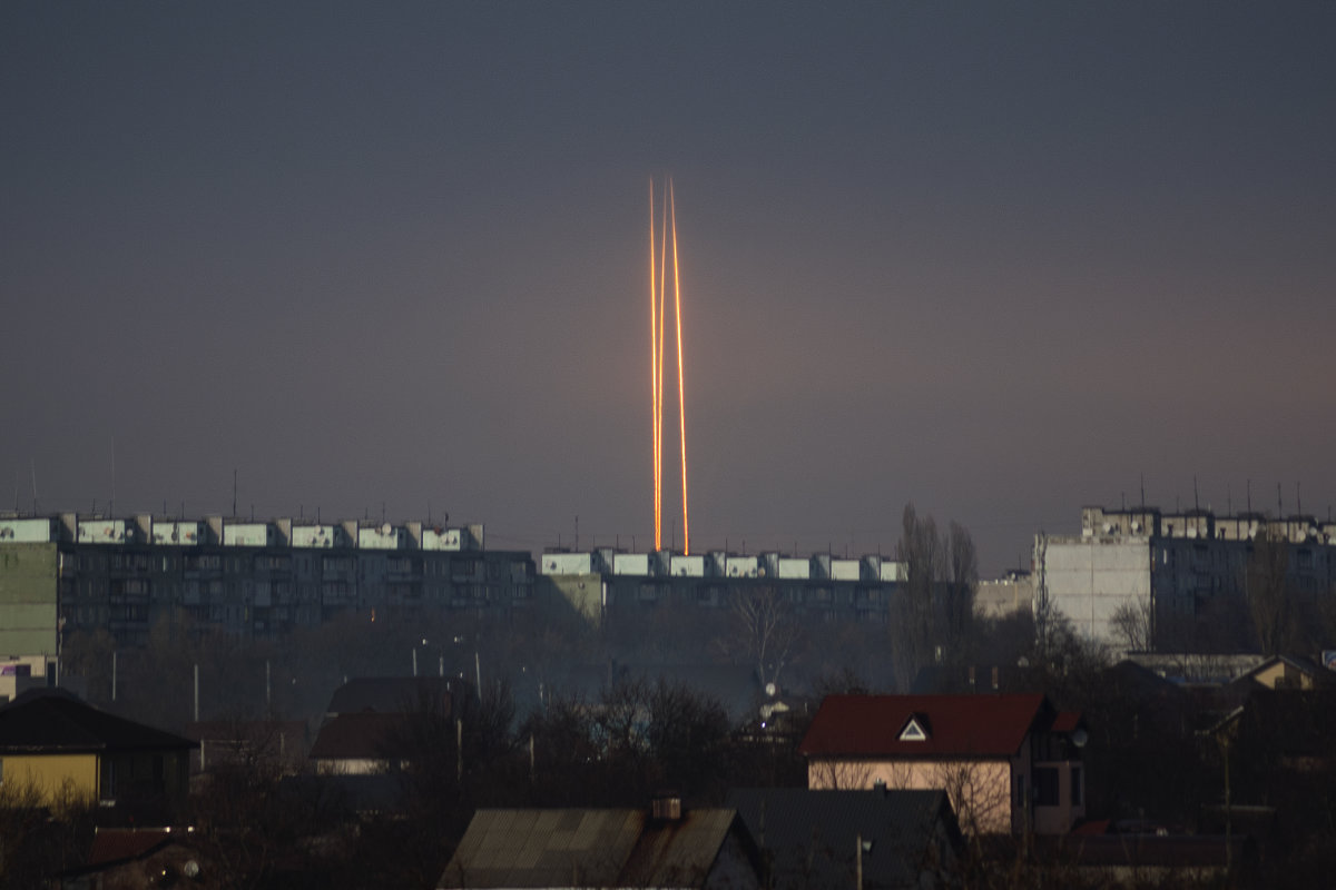 Three Russian rockets launched against Ukraine from Russia's Belgorod region are seen at dawn in Kharkiv, Ukraine, early on March 9, 2023. (AP Photo/Vadim Belikov)