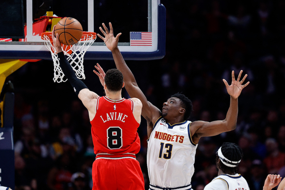 Chicago Bulls guard Zach LaVine drives to the net against Denver Nuggets center Thomas Bryant in the fourth quarter of their NBA game at Ball Arena on Wednesday. (USA TODAY Sports)