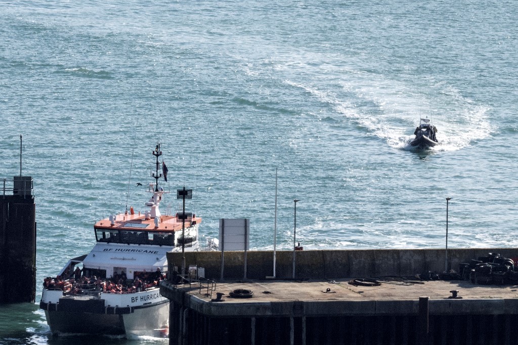 Above, BF Hurricane arrives in Dover carrying migrants picked up in the English Channel on Oct. 18, 2022. The UK government’s proposal would see migrants choosing the cross-channel route lose any right to claim asylum. (AFP file photo)