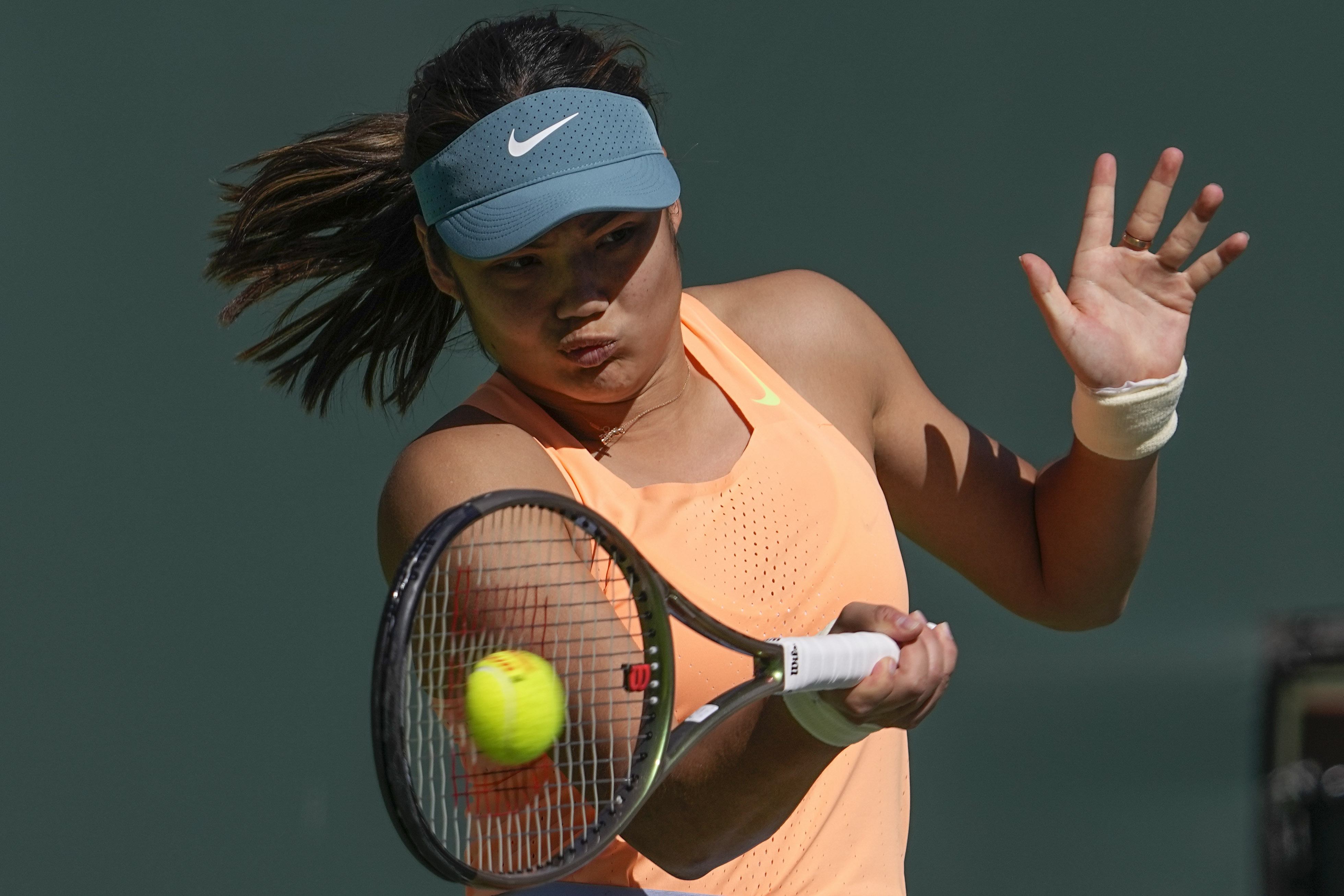 Emma Raducanu, of Britain, returns to Danka Kovinic, of Montenegro, at the BNP Paribas Open tennis tournament in Indian Wells, Calif. (AP)