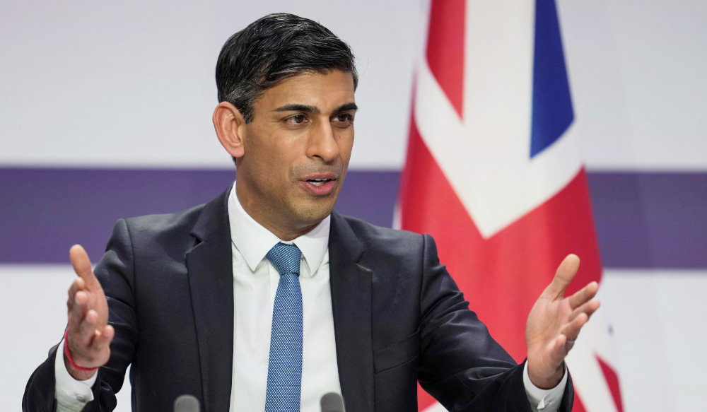 Britain's Prime Minister Rishi Sunak speaks during a joint press conference with France's President at the end of the French-British summit, at the Elysee Palace, in Paris, on March 10, 2023. (AFP)