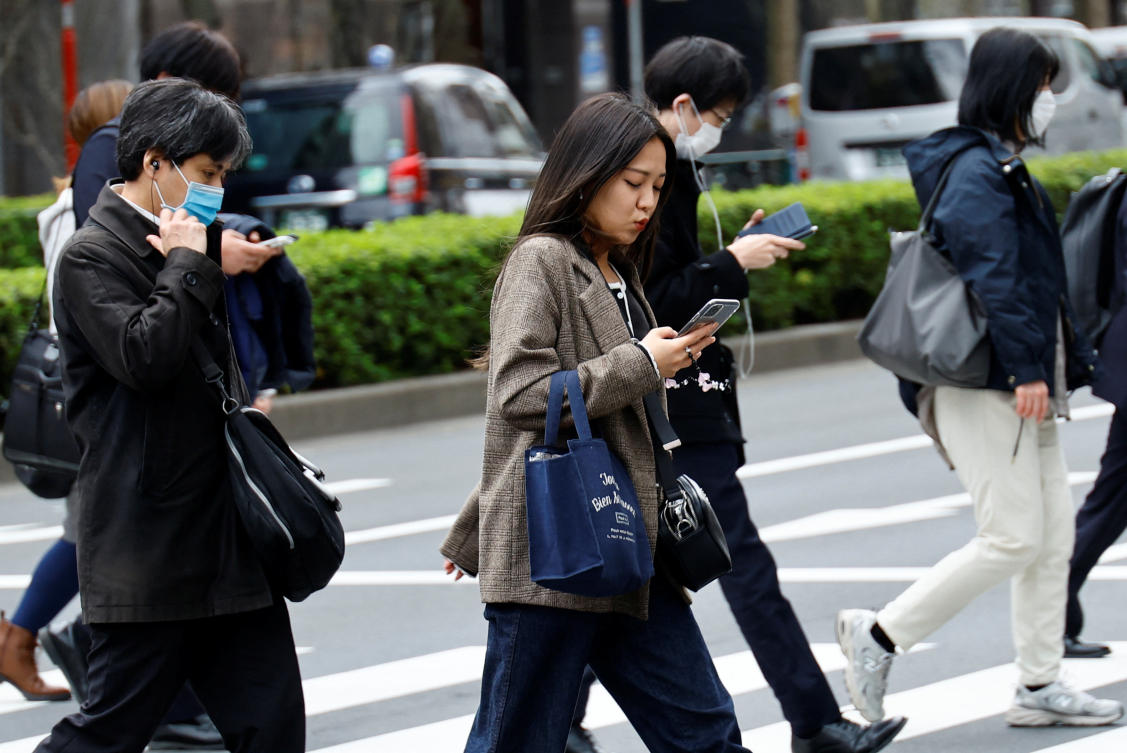 Japan is one of the last major economies to relax official guidance on face masks, whose usage has been nearly universal throughout the country even without firm regulations or penalties governing their use. (Reuters)