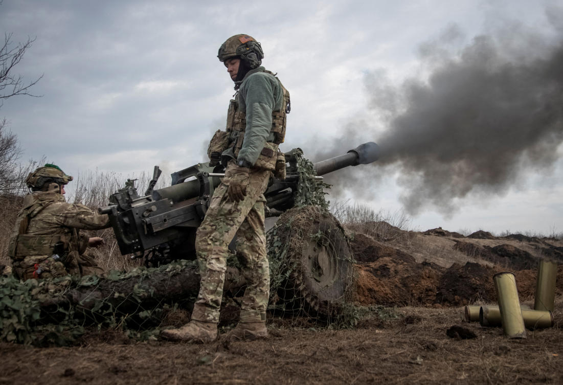 The Ukrainian military say they are ‘inflicting significant losses on the enemy.’ Above, Ukrainian service members fire a howitzer M119 at a front line near the city of Bakhmut. (Reuters)