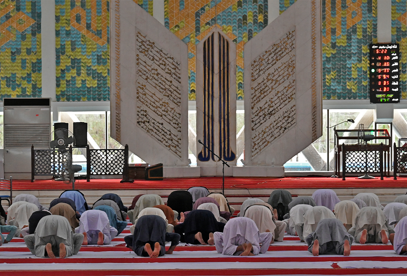 Muslim devotees offer prayers in the Grand Faisal Mosque at the start of Itikaf, a spiritual retreat in a mosque for men during the holy month of Ramadan in Islamabad on May 3, 2021. (AFP/File)