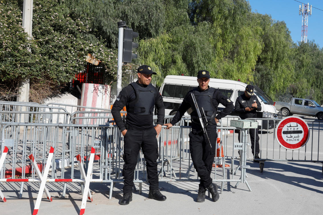 Police officers stand guard outside Tunisia's parliament as the new parliament, elected in December and January in a vote with ultra-low turnout, holds its first session, in Tunis, Tunisia March 13, 2023. (Reuters)