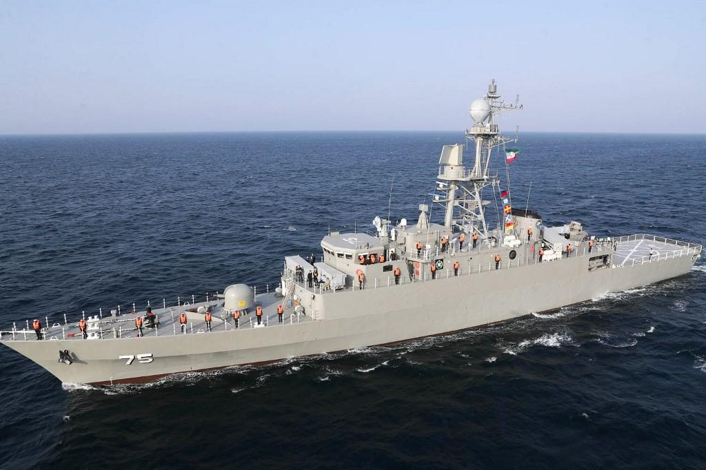 A handout picture made available by the Iranian Army official website on January, 21 2022 shows a crew taking part in a parade of Iranian, Russian, and Chinese warships during a joint military drill in the Indian ocean. (AFP)