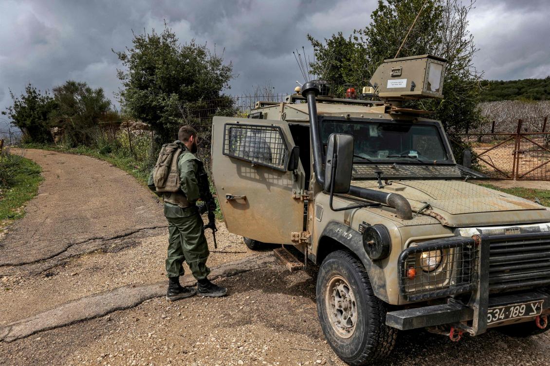 Israeli soldiers patrol along the border with Lebanon near the northern Arab-Israeli village of Arab Al-Aramshe on Mar. 15, 2023. (AFP)