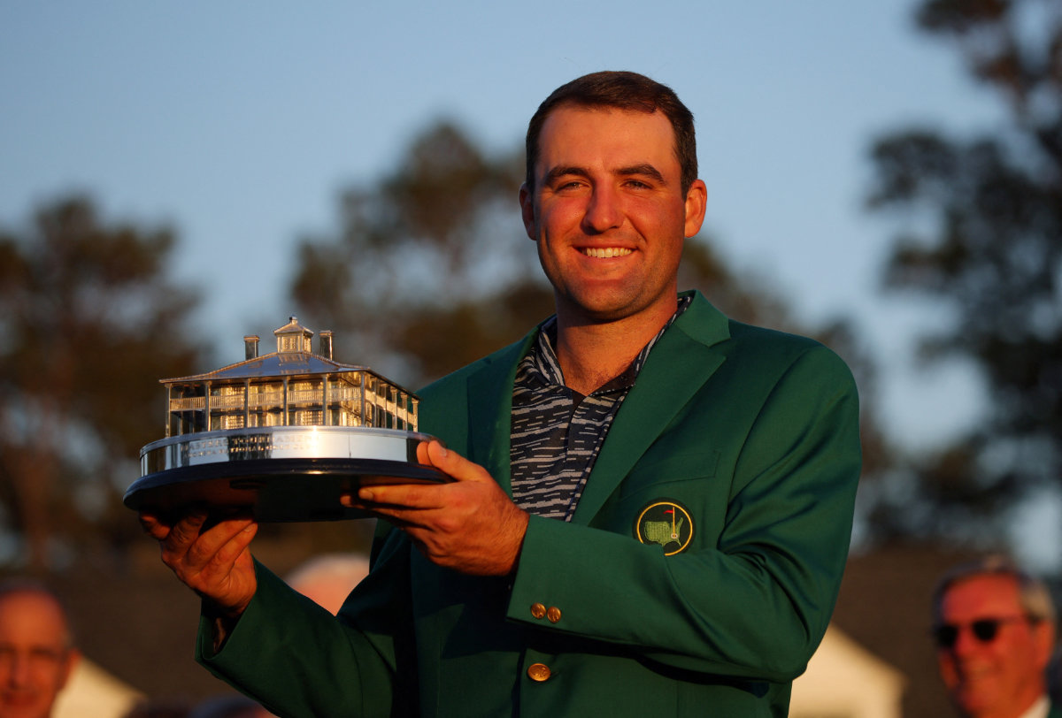 In this April 10, 2022 file photo, Scottie Scheffler of the US poses in his green jacket with the trophy after winning The Masters. (Reuters)