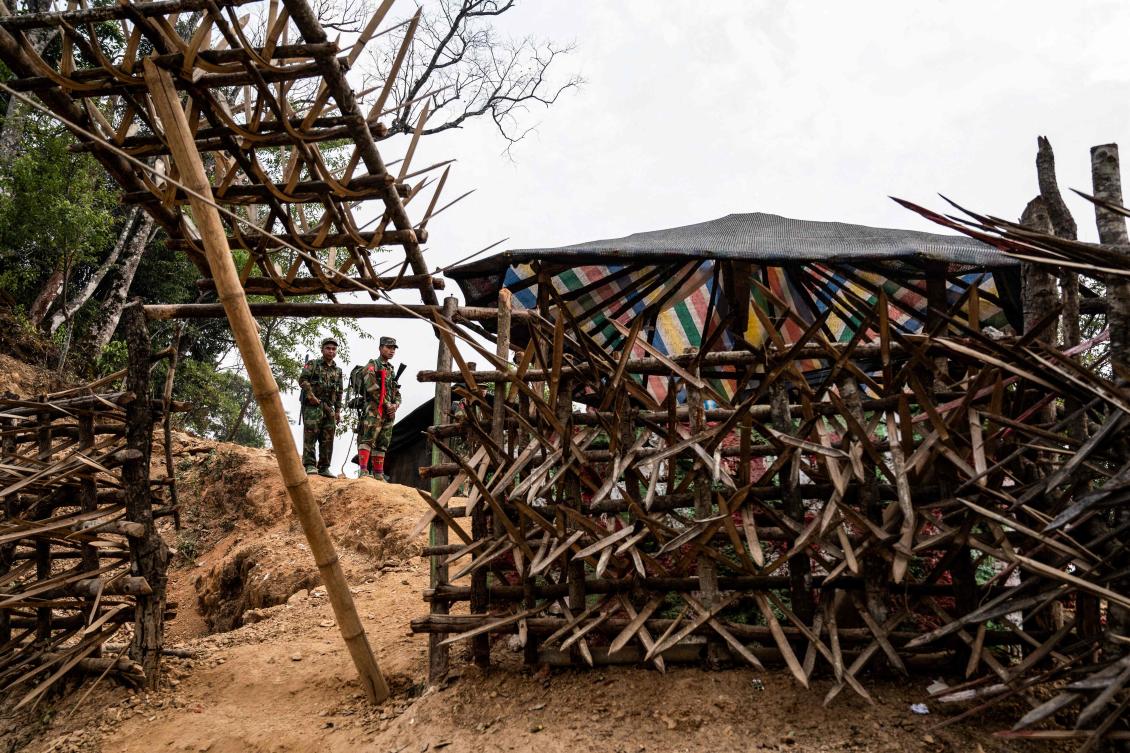 Myanmar has been gripped by violence and unrest since a coup in February 2021. Above, members of ethnic rebel group Ta’ang National Liberation Army stand guard at a checkpoint near Namhsan Township in Myanmar’s northern Shan State. (AFP)
