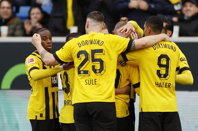 Borussia Dortmund players celebrate after Julian Brandt scores their first goal during their Bundesliga match against TSG 1899 Hoffenheim at PreZero Arena, Sinsheim, Germany on Feb. 25, 2023 (Reuters/File)