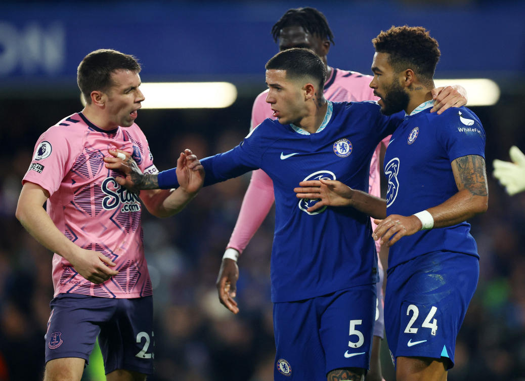 Everton’s Seamus Coleman clashes with Chelsea’s Joao Felix and Reece James during their Premier League match at Stamford Bridge, London on Mar.18, 2023. (Reuters)