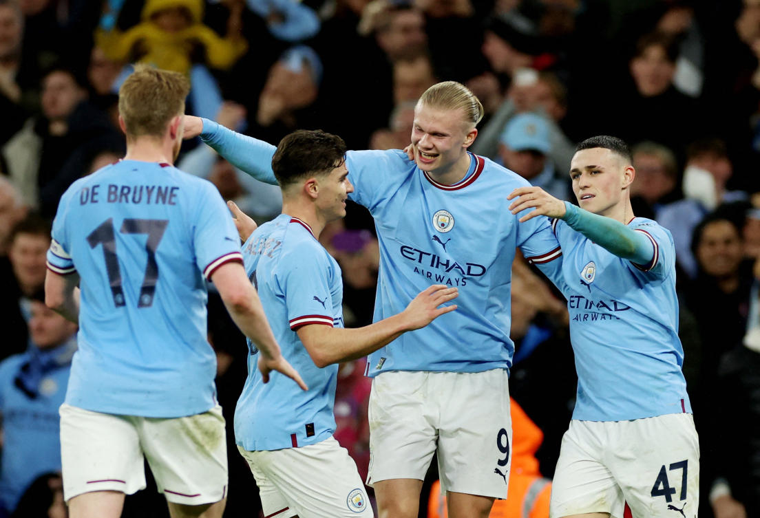 Manchester City’s Erling Braut Haaland celebrates scoring their first goal with Julian Alvarez and Phil Foden during their FA Cup quarter final against Burnley at Etihad Stadium, Manchester, on Mar. 18, 2023. (Reuters)