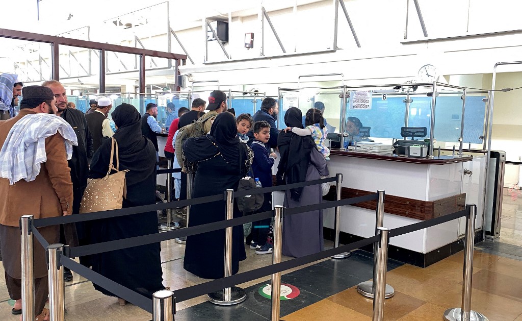 A group of Afghan athletes and their family members wait to board a flight. (File/AFP)