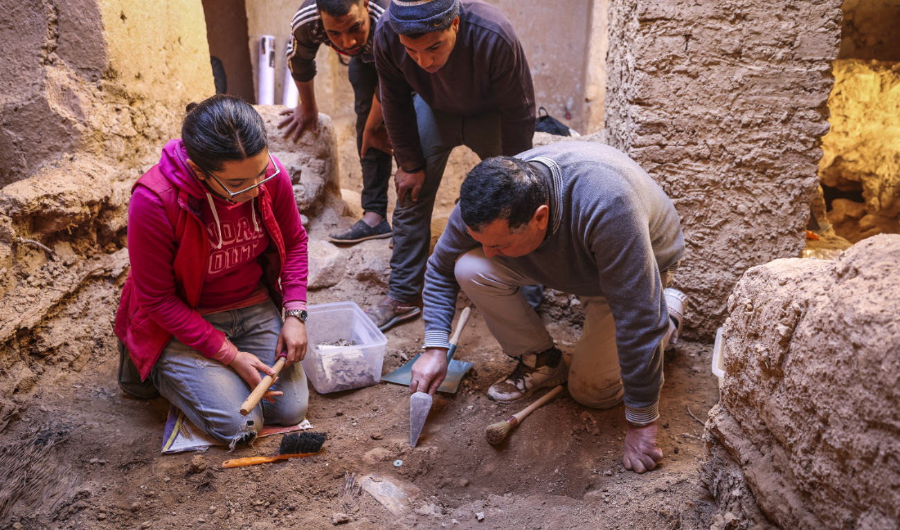 Archaeologists dig in the ruins of a synagogue in the Jewish neighbourhood, or mellah, in the village of Tagadirt in Morocco's oasis region of Tata on February 28, 2023. (AFP)