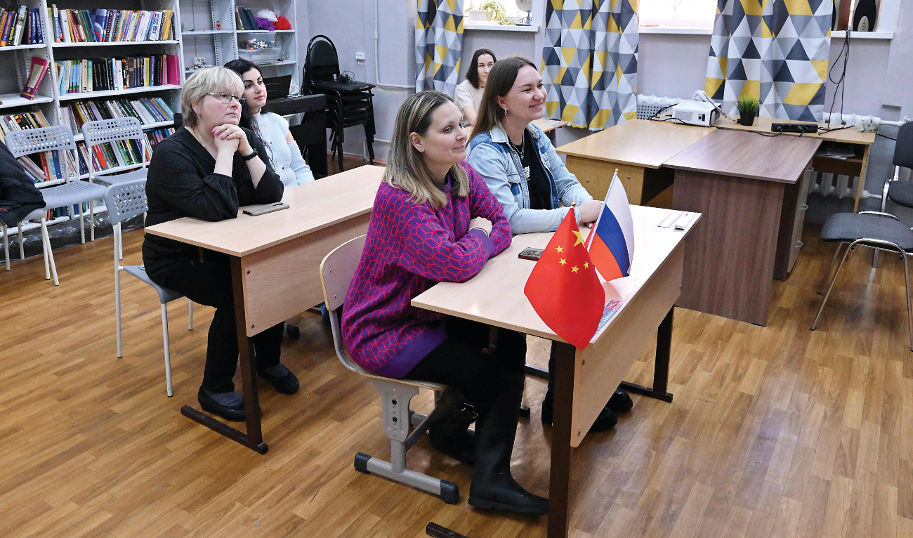 Adults attend a Chinese lesson at the ChineseFirst language center, in the town of Reutov, outside Moscow, on Friday. (AFP)