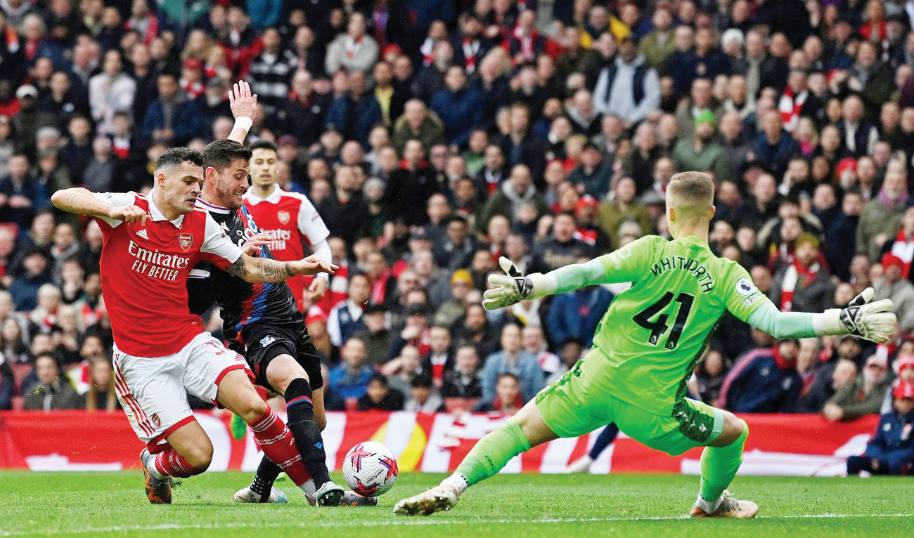 Arsenal’s Granit Xhaka scores the third goal against Crystal Palace at the Emirates Stadium in London. Arsenal surged 8 points clear at the top of the league. (AFP)