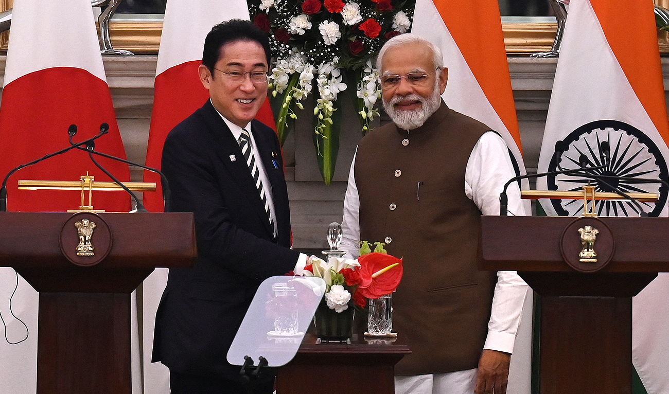 Japan's Prime Minister Fumio Kishida (L) shakes hands with his Indian counterpart Narendra Modi after attending a joint media briefing at the Hyderabad House in New Delhi on March 20, 2023. (Photo courtesy: AFP)