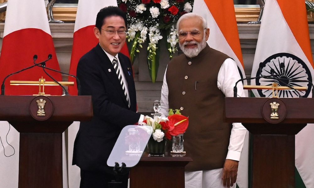 Japan’s Prime Minister Fumio Kishida, left, shakes hands with his Indian counterpart Narendra Modi after attending a joint media briefing at Hyderabad House in New Delhi on March 20, 2023. (AFP)