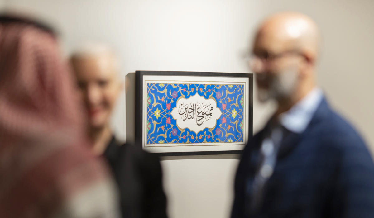 Saudi artist Nasser Alsalem displays "No Smoking," an artwork part of his "Prohibited" series using traditional Arabic calligraphy, challenging its its boundaries and its adaptability to modern contexts. (Photo/Misk Art)