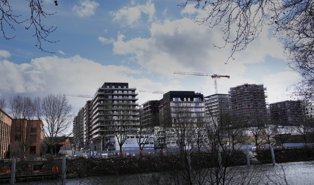 The Olympic athletes' village construction site is pictured In Saint Denis, outside Paris, Saturday. Paris Olympics organizers are going underground to find a way to keep athletes cool at the 2024 Games without air conditioners. (AP)