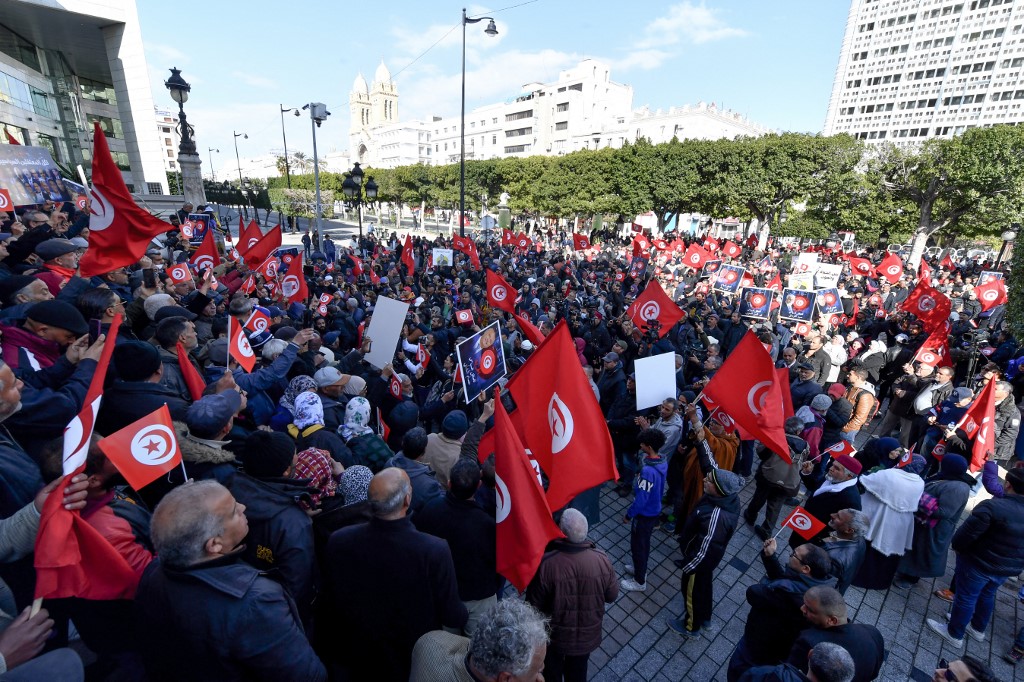 People take part in a demonstration in Tunis (AFP)