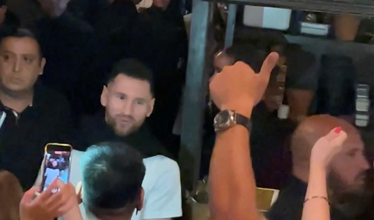 Lionel Messi leaves a steakhouse restaurant in Buenos Aires on Tuesday in this screengrab obtained from a social media video. (Instagram @adriiperedo/via Reuters)