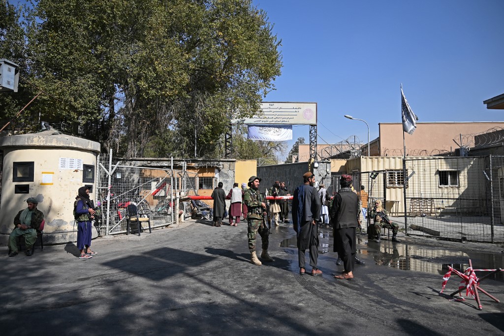 Taliban fighters stand guard at an entrance gate of the Sardar Mohammad Dawood Khan military hospital in Kabul on November 3, 2021. (AFP)