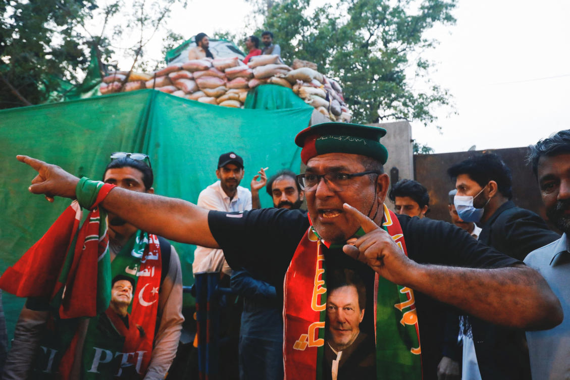 A supporter of Imran Khan, the former Prime Minister of Pakistan, reacts as he along with others gather outside Khan's house in Lahore, Pakistan March 21, 2023. (Reuters)