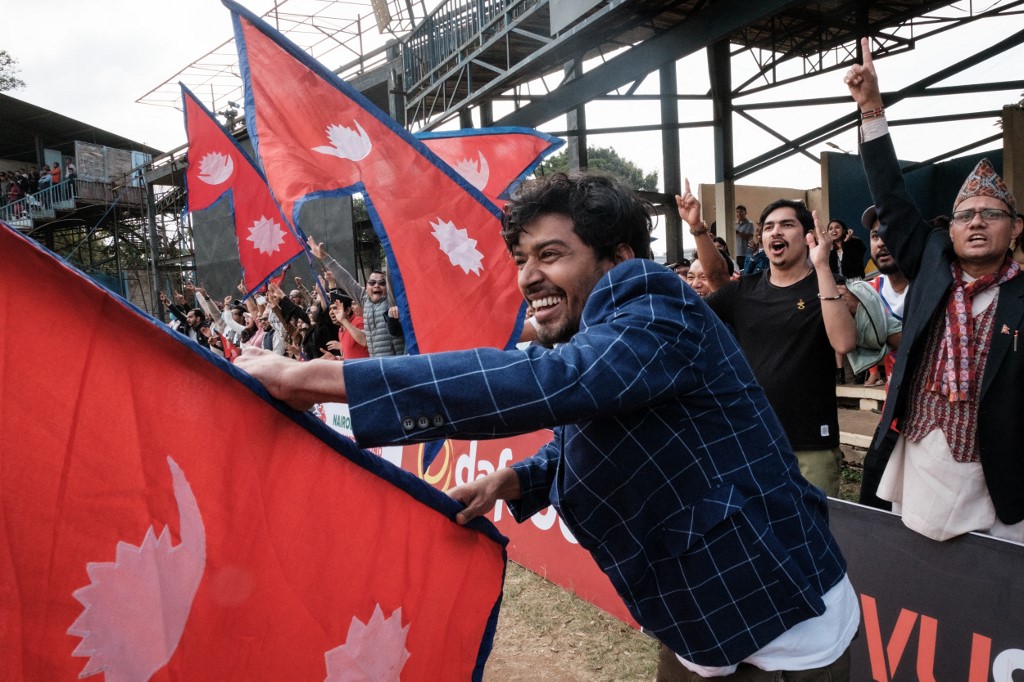 Above, fans of the Nepalese cricket team during the third T20 international match between Kenya and Nepal at the Nairobi Gymkhana Cricket Grounds in Nairobi on Aug. 28, 2022. (AFP)