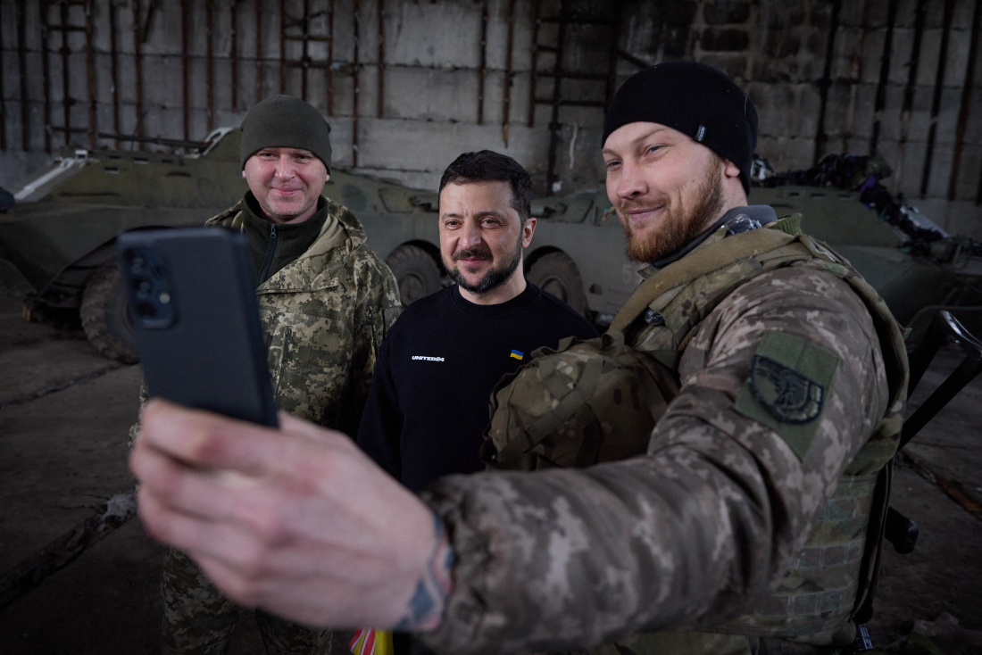 Ukraine’s President Volodymyr Zelensky takes selfie with servicemen after meeting them in a warehouse and handing out awards, near Bakhmut. (File/AFP)