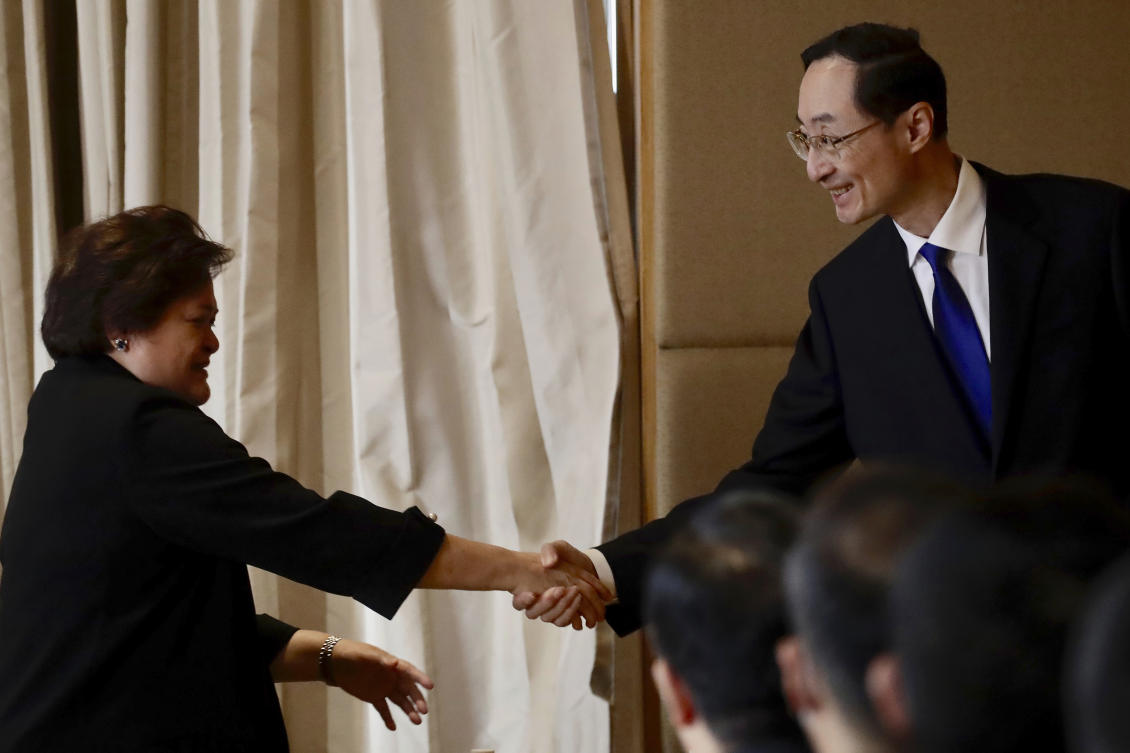 Above, Philippine foreign affairs undersecretary Theresa Lazaro and Chinese vice foreign minister Sun Weidong during their bilateral meeting in Manila on March 24, 2023. (AP)