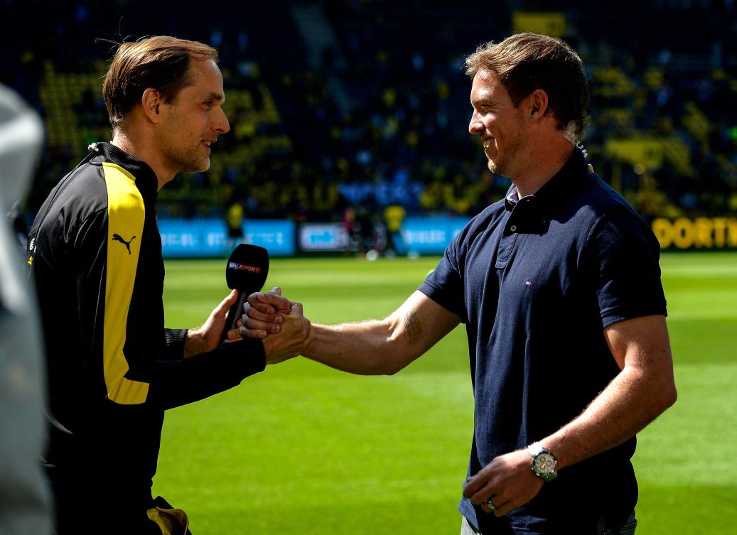 This file photo taken on May 6, 2017 shows then Dortmund’s head coach Thomas Tuchel and then Hoffenheim’s head coach Julian Nagelsmann shaking hands prior to their Bundesliga match in Dortmund. (AFP)